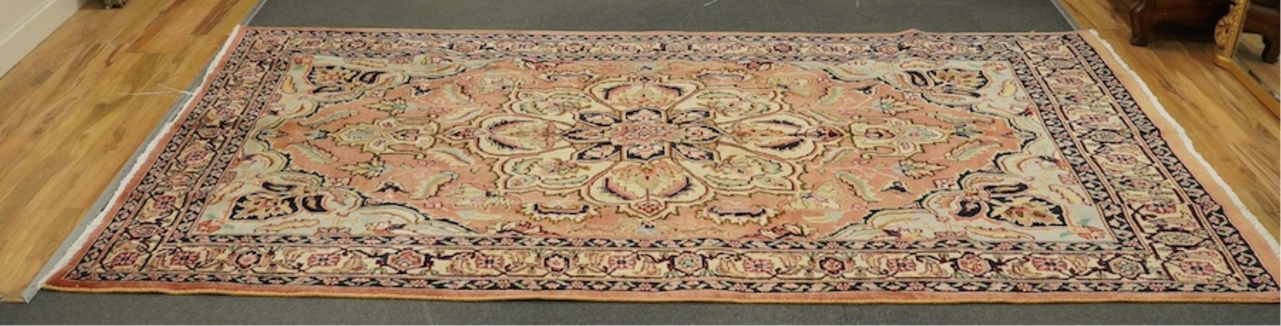 An Ardabil pale red ground carpet, 286 x 192cm. Condition - good